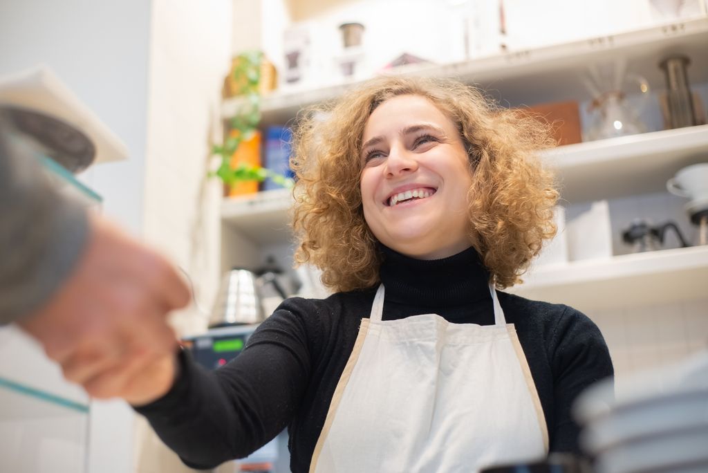 Happy business owner with Barsy software